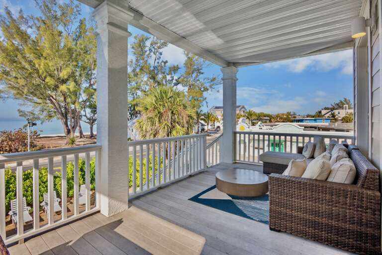 Private covered porch with comfortable seating