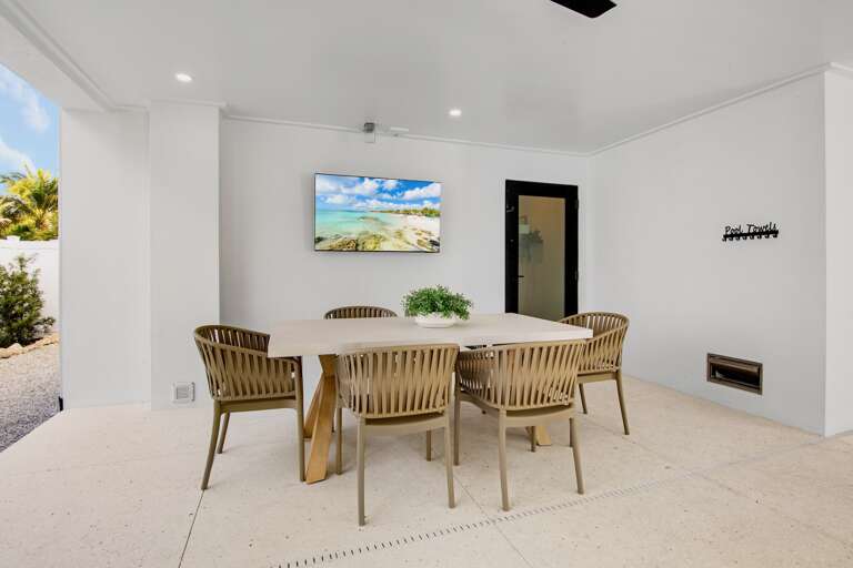 Outdoor dining table with TV.