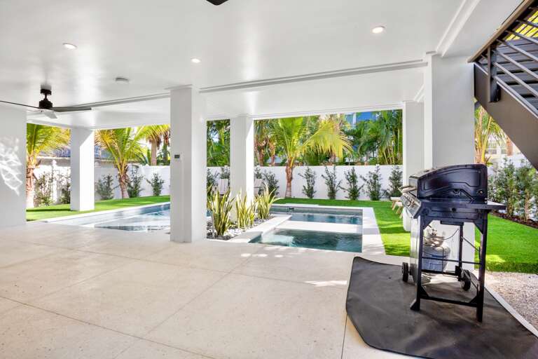 Outdoor oasis with pool, hot tub, and BBQ grill