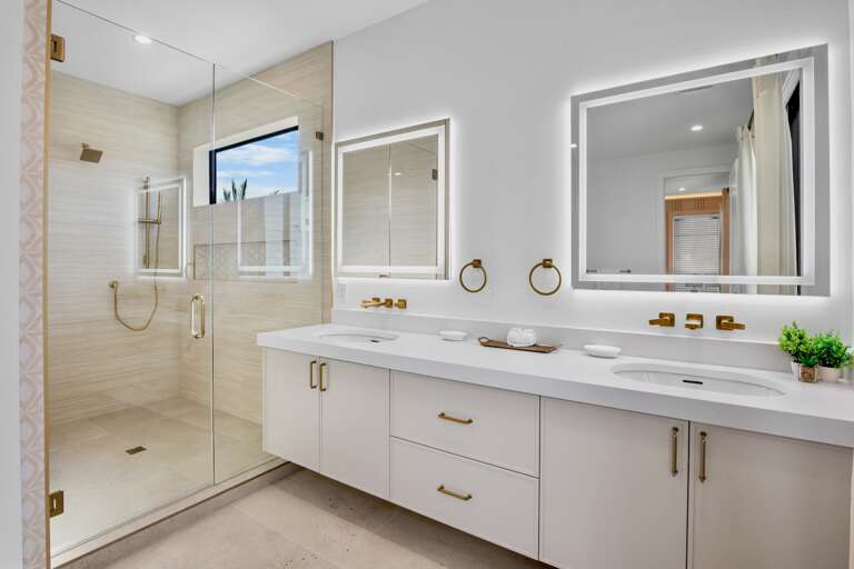 Primary bathroom with walk-in shower and standalone soaking tub