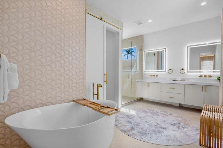 Primary bathroom with walk-in shower and standalone soaking tub