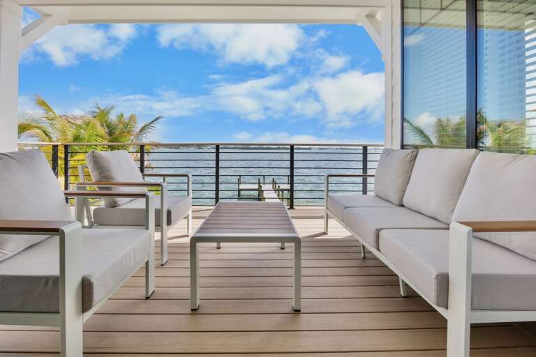 Private balcony with plush seating and ocean views
