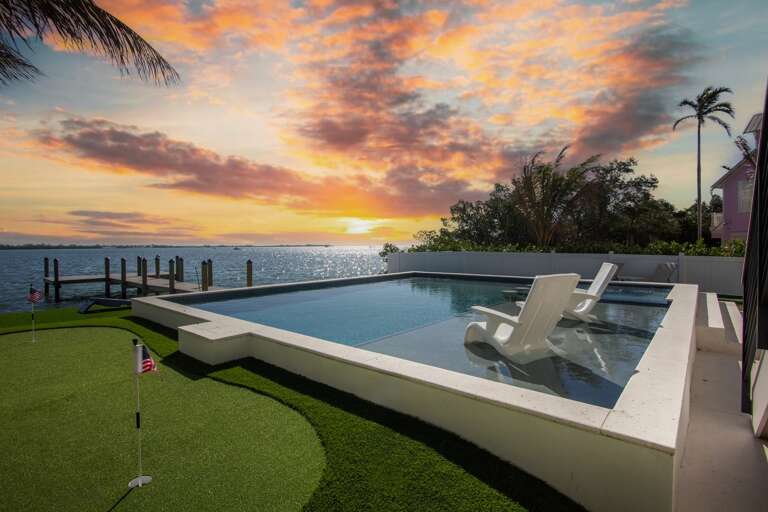 Private pool, putting green, and waterfront dock