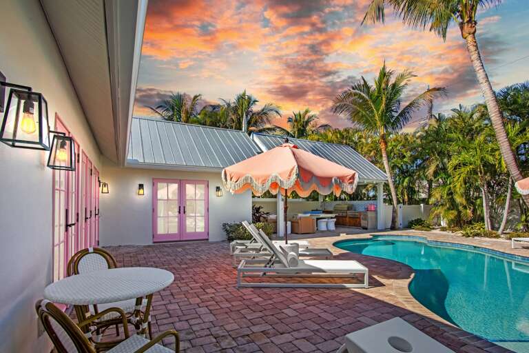 Tropical paradise with private pool, loungers, and sunset views