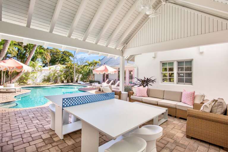 Relax in your covered poolside pavilion with comfortable seating, ping pong, and direct access to the pool