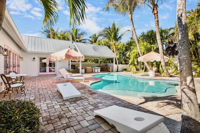 Private oasis with pool and cornhole