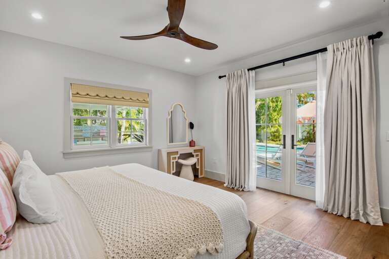 Primary bedroom with pool access, King bed