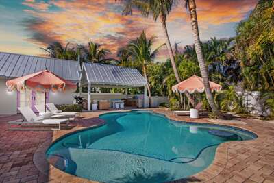 Private pool and lounge with tropical surroundings