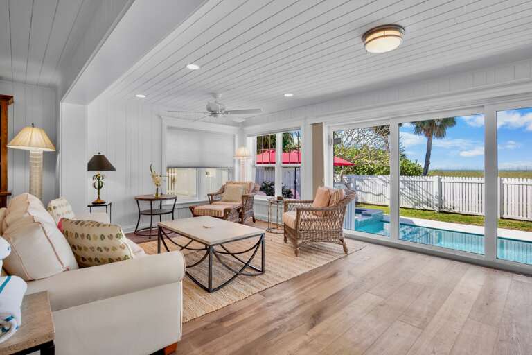 Additional living area with view of the pool