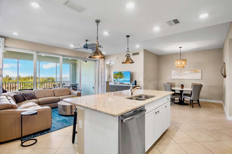 Open living and dining area with private screened lanai access
