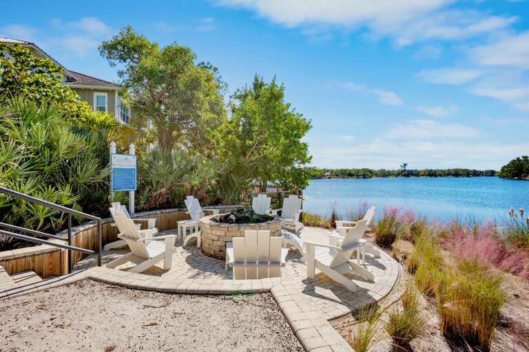 Waterfront fire pit lounge with Adirondack seating