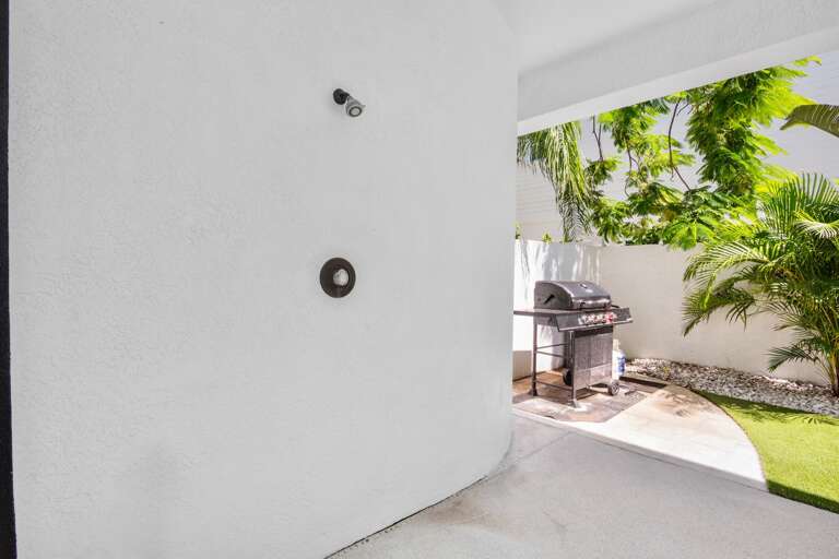 Refreshing outdoor shower for guests and BBQ grill