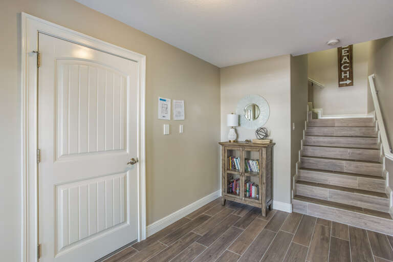 Main Entryway - Game room and Stairs to Main Floor
