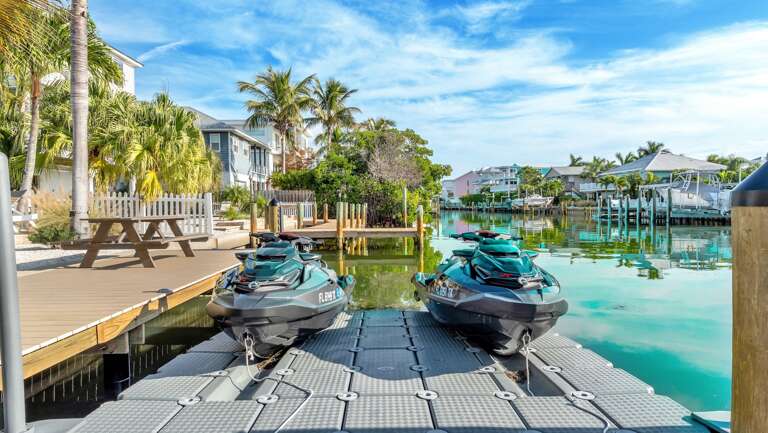 Private dock with two jet skis