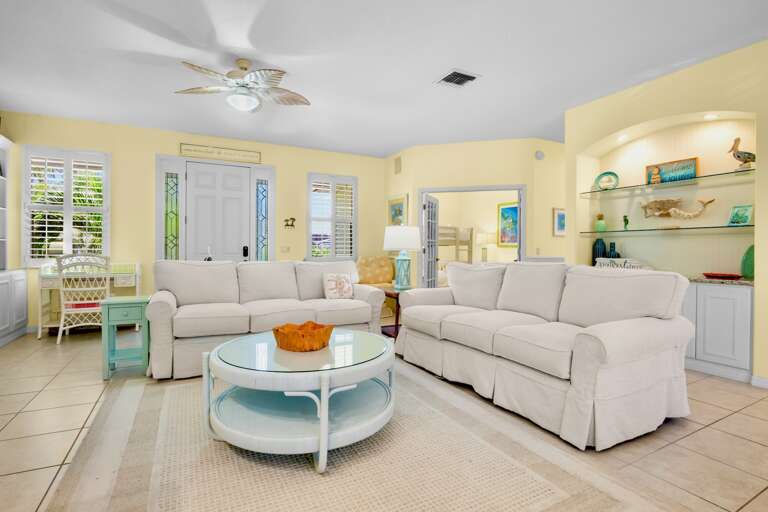 Bright Living Area with Cozy Seating and TV