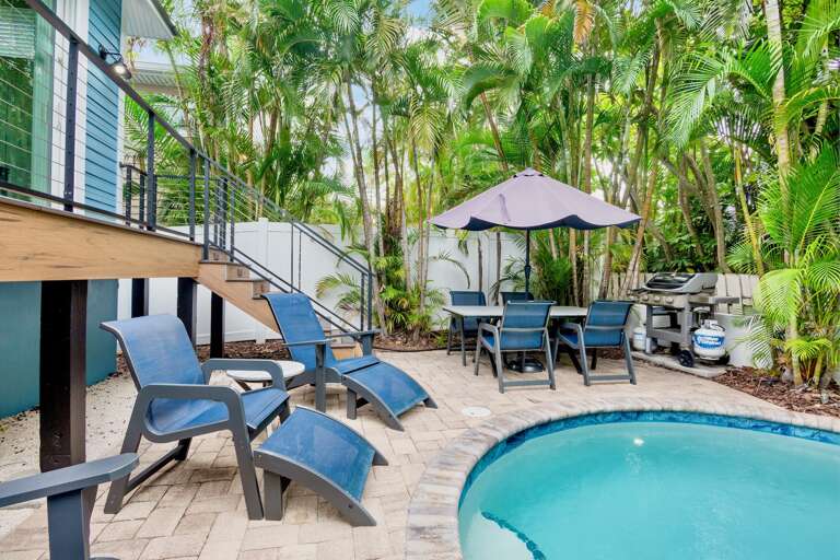 Poolside Loungers and Dining Area