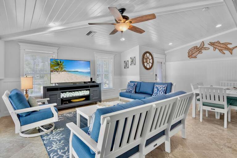 Living space with cozy blue seating and beachy decor
