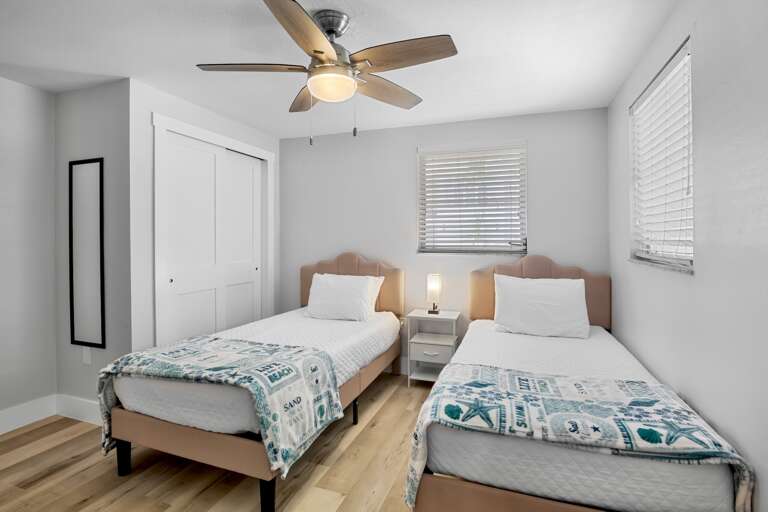 Second bedroom with two twin beds.
