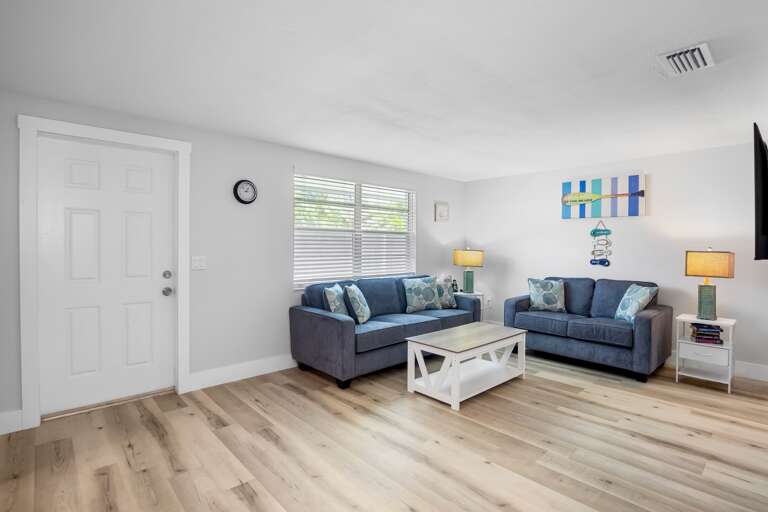 Open living space with comfortable seating and easy access to the kitchen.