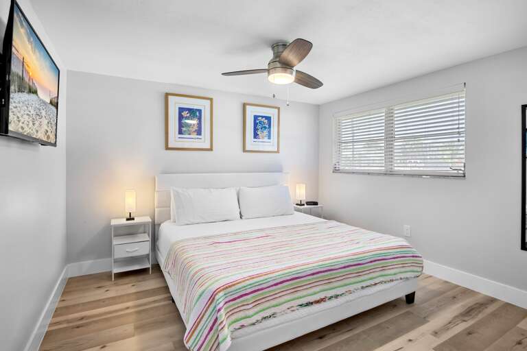 Primary bedroom with king bed and plenty of natural light.