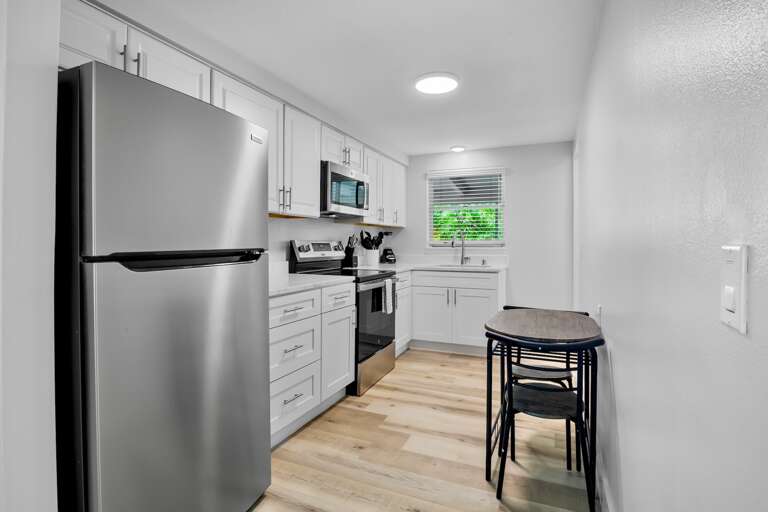 Fully equipped kitchen with dining space for casual meals.