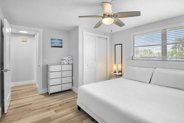 Primary bedroom with king bed and plenty of natural light.