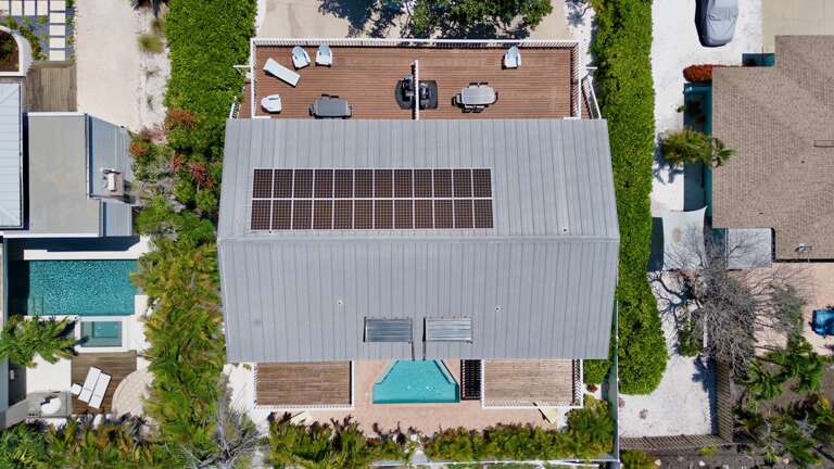 Drone view of house and pool