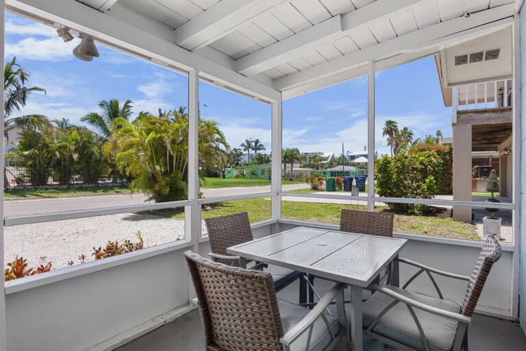 Relax and enjoy outdoor dining in the screened patio.