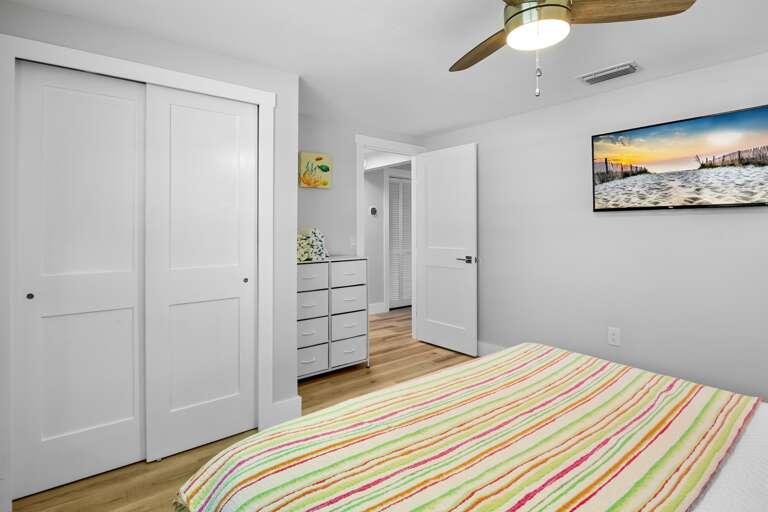 Relaxing primary bedroom retreat with king bed.