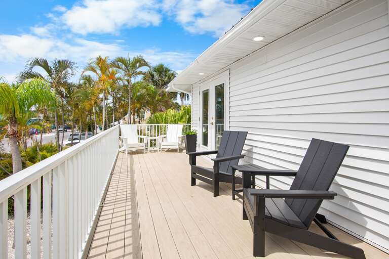 Outdoor deck with Adirondack seating and tropical views