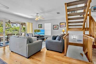 Living Room with Plush Seating and Screened Lanai Access