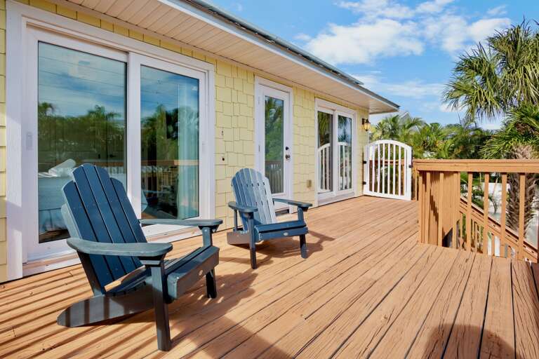 Private deck with classic Adirondack chairs