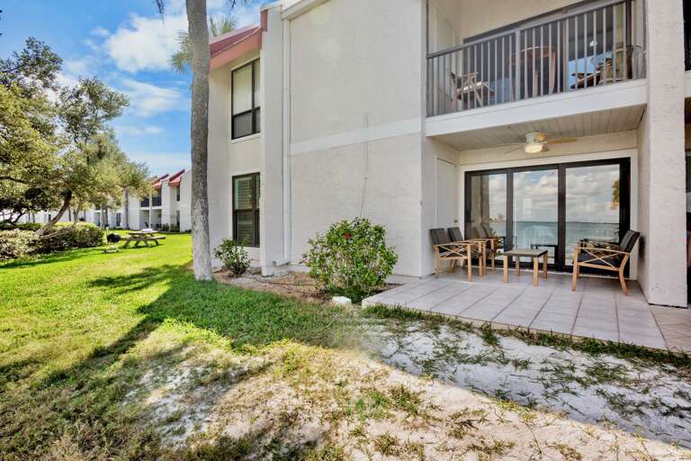 Waterfront home with private patio seating area