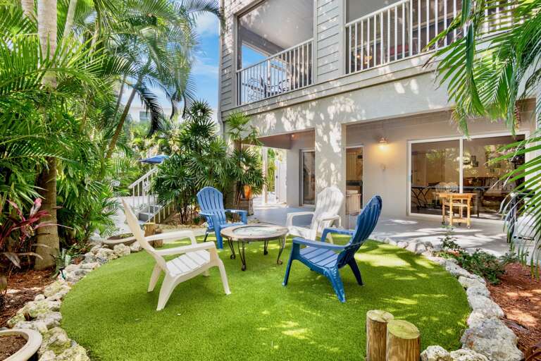 Colorful lounge chairs on lush green turf