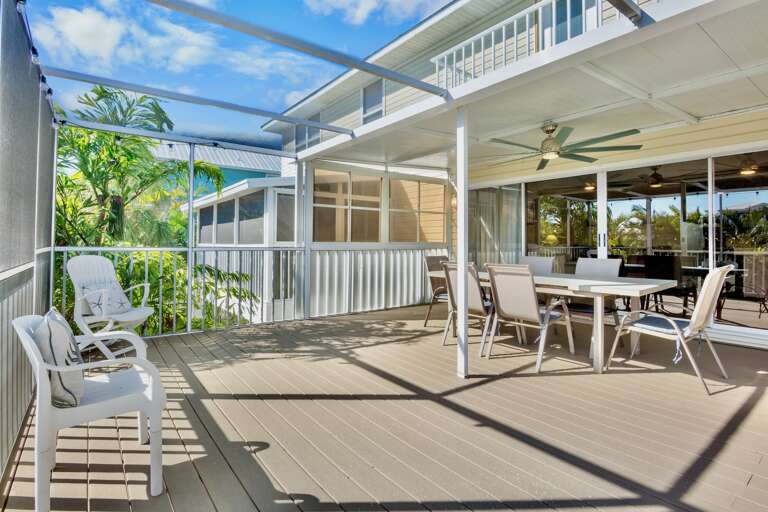 Covered deck offers dining for six