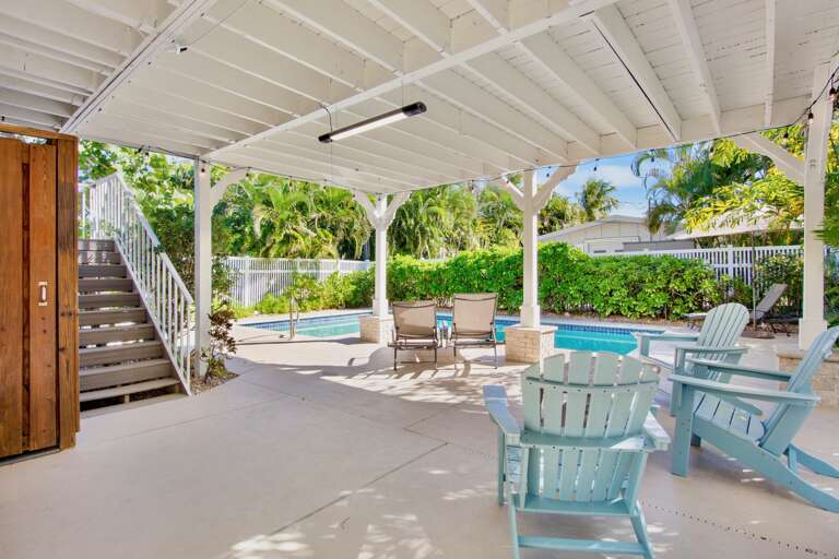 Private poolside oasis with comfortable seating