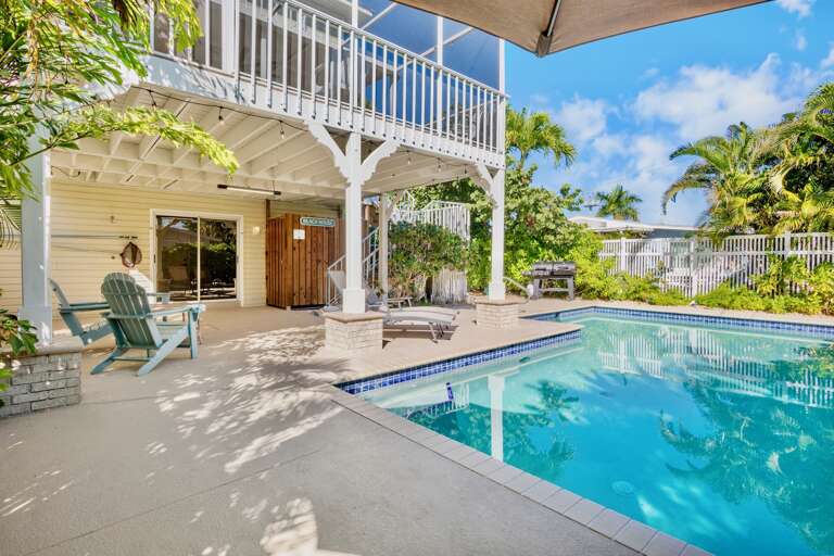 Private poolside oasis with comfortable seating