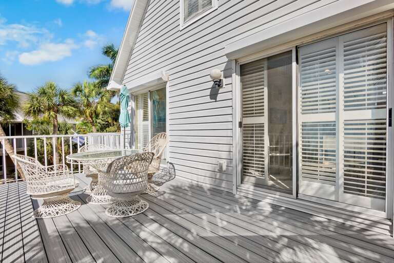 Outdoor dining space with tropical surroundings