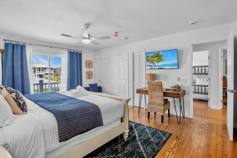 Primary Bedroom, King bed, workspace, and balcony