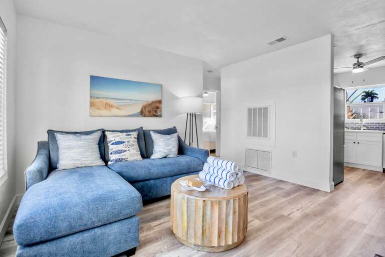 Living space with plush blue seating