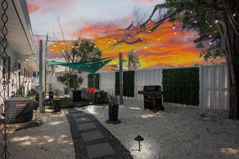 Private backyard oasis with BBQ grill and seating area