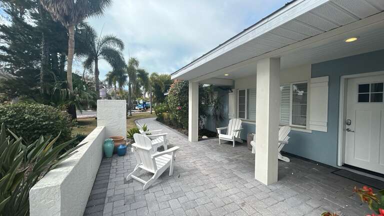 Your private covered patio with stylish seating invites morning coffee and evening relaxation.