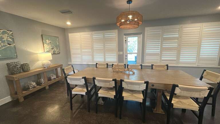 Gather around this stunning dining table for memorable meals with family and friends in this bright, elegantly appointed space.