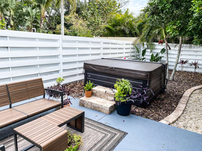 Private hot tub in a fenced backyard