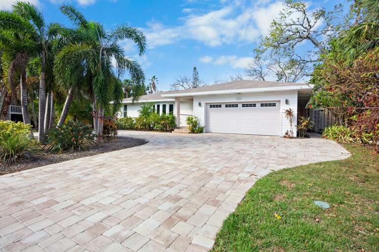 Spacious front yard with tropical landscaping