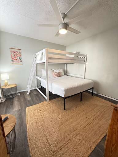 Second Bedroom features a unique bunk bed configuration with a full bed below and twin above, perfect for accommodating multiple guests comfortably.