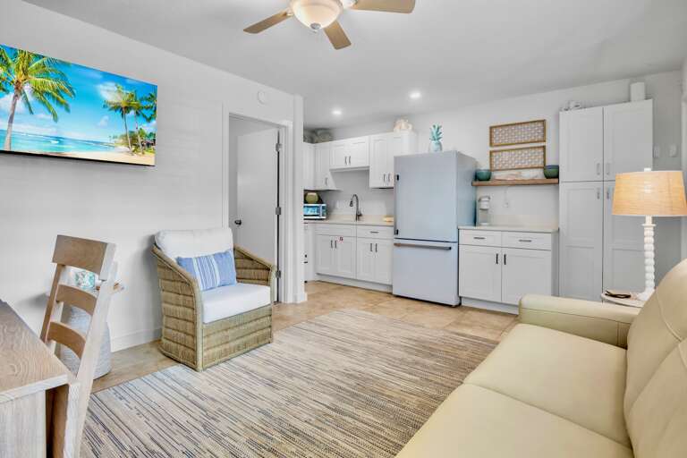Unwind in your bright, coastal-themed space where tropical artwork and beachy blues create the perfect vacation vibe for cooking and relaxing.