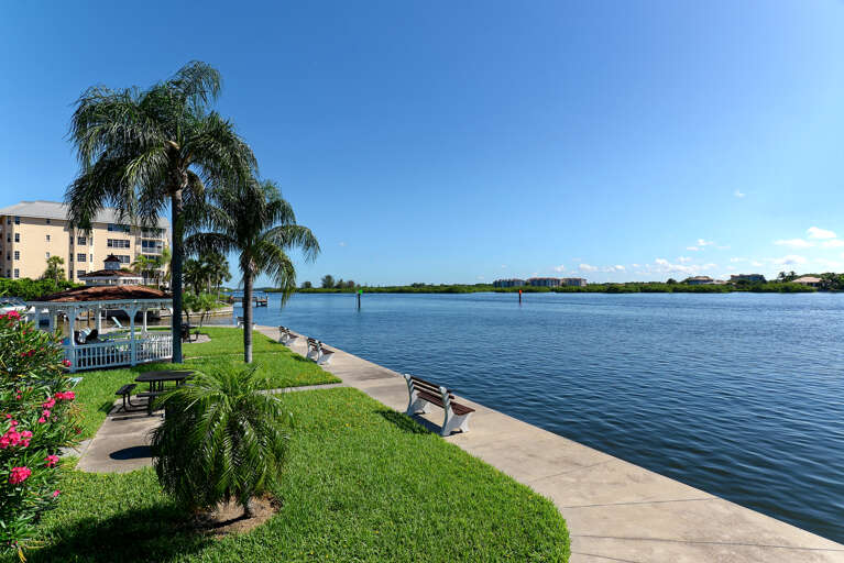 Waterfront property offering direct access to pristine bay waters with tropical landscaping and nearby amenities.