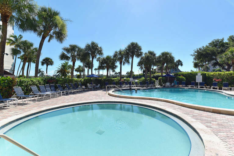 Soak up the Florida sunshine by sparkling pools surrounded by swaying palms and comfortable loungers.