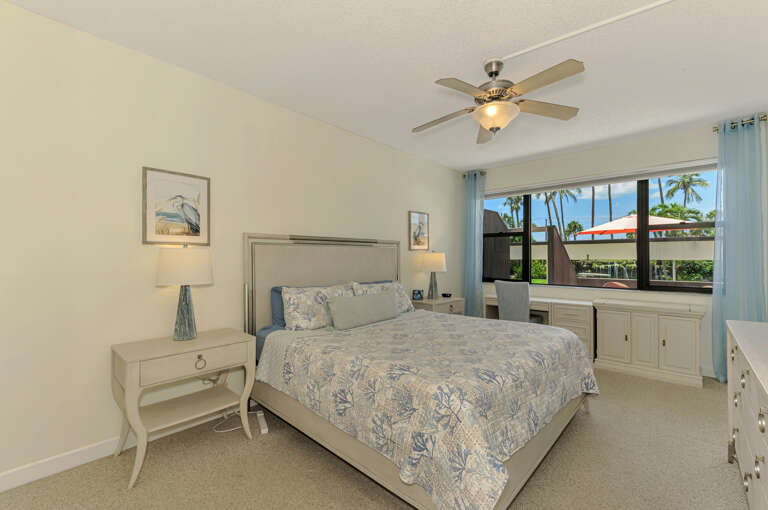 Wake up in your peaceful bedroom with tropical palm views and a gentle ceiling fan to keep you comfortable throughout the night.